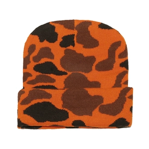 Detailed close-up of orange and black camo knit beanie showing soft textured fabric