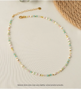 Close-up of colorful natural stone beads with gold spacers and lobster clasp detail