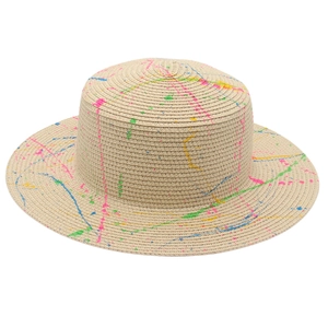 Detail of artistic spray-painted flat top straw hat with colorful graffiti on beige base