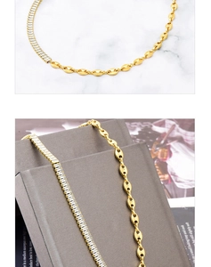 Detail of gold-plated titanium steel necklace with rectangular zircon and marina chain links