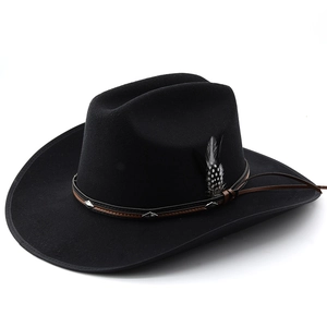 Detail of wool felt cowboy hat featuring leather band with studs and feather accent