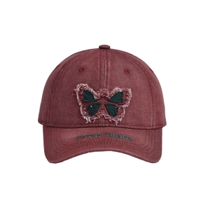 Detail of burgundy washed cotton baseball cap with pink butterfly patch and green embroidery