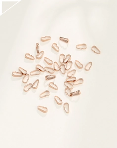 Detailed view of rose gold plated 925 silver pendant pinch bails for jewelry DIY