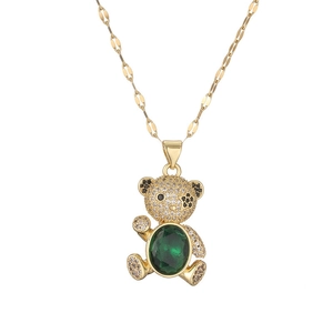 Charming gold necklace with teddy bear pendant set with crystals and green gemstone