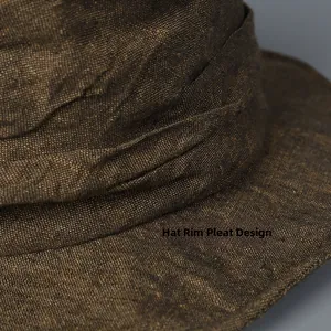 Close-up detail of the pleated design on a dark brown linen bucket sun hat crown