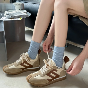 Retro khaki suede sneakers with non-slip soles shown in a lifestyle home setting