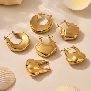 Set of three pairs of 18K gold-plated geometric hoop earrings with high polish finish