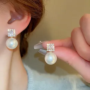Elegant silver needle earrings with square zircon and large round white pearl drop