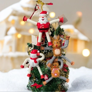 Detail of Christmas telescopic pipe toys with suction cups on a mini tree