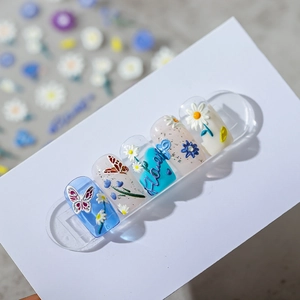 3D embossed floral nail stickers with blue butterflies and daisy art designs