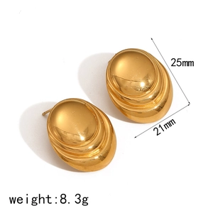 Detailed view of gold spiral titanium earrings with 25mm dimensions and 8.3g weight