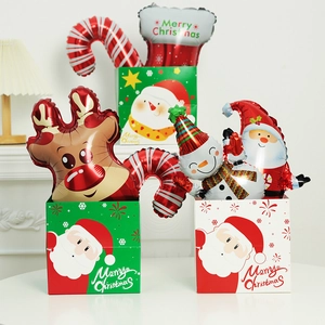 Christmas gift set with Santa Claus, reindeer balloons and festive Merry Christmas boxes