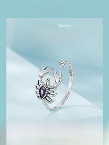 Macro shot of vintage S925 sterling silver scorpion ring with purple gemstone