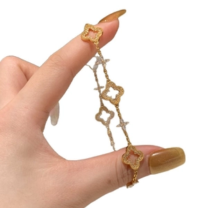 Elegant 24K gold-plated clover bracelet featuring white cubic zirconia stones