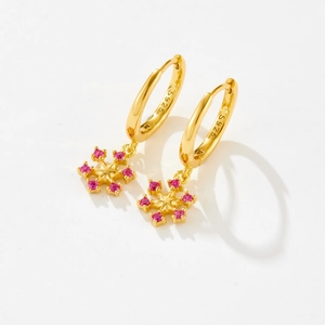 Elegant S925 sterling silver hoop earrings with pink snowflake charms in gold finish