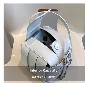 Internal capacity of white woven small box bag with silver chain and magnetic closure