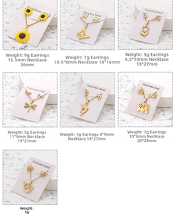 Various stainless steel jewelry sets with sunflower and butterfly pendants on cards