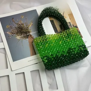 Detail of green gradient acrylic beaded handbag with high-gloss handcrafted textures
