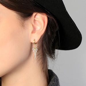 Elegant gold drop hoop earrings with five pointed pendants encrusted with white cubic zirconia