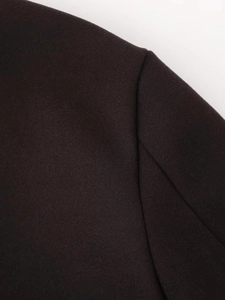 Macro shot of dark wool fabric texture and reinforced seam craftsmanship detail