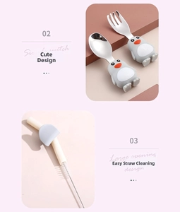Detail of stainless steel penguin spoon, fork, and straw cleaning brush for toddlers