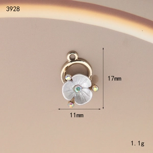 Detailed view of floral alloy pendant with white matte petals and colorful rhinestones