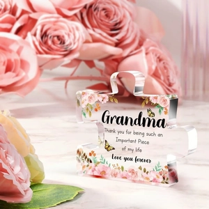 Close-up of puzzle-shaped acrylic keepsake for grandma with floral and butterfly details