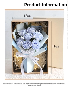 Detail view of blue soap flower bouquet with baby's breath in a 13x19cm gift box