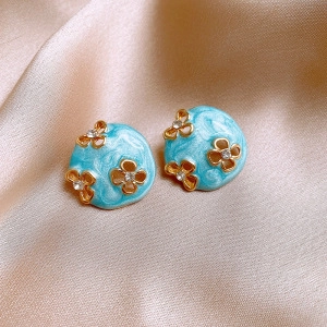 Elegant light blue enamel earrings with golden flowers and sparkling rhinestones for women
