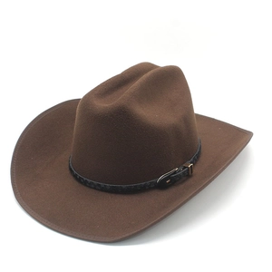 Detail view of brown felt cowboy hat with braided leather band and metal buckle accessory