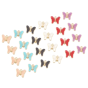 Flat lay of colorful alloy butterfly charms for DIY jewelry making on white background
