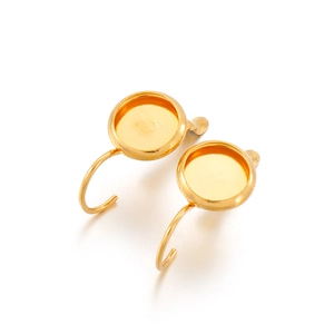 Detail showing a pair of gold titanium steel earring bases for DIY jewelry making