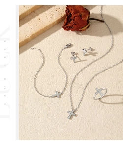 Luxurious S925 sterling silver cross jewelry set with pavé diamonds and a dried rose