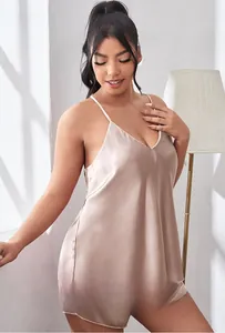 Detailed view of champagne satin pajama set with V-neck camisole and matching shorts