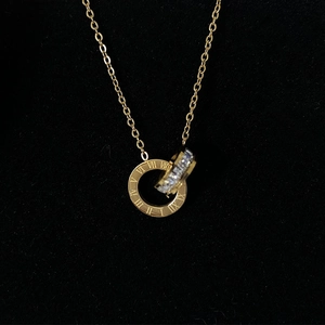 Titanium steel gold necklace with double interlocking Roman numeral and crystal rings