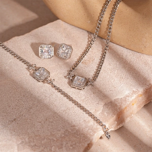 Luxury geometric square zircon necklace and earring set on stone background