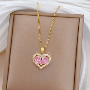 Elegant gold titanium steel necklace with hollow pink heart and sparkling crystals