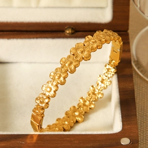 18K gold-plated stainless steel flower cuff bracelet with a floral pattern and polished finish