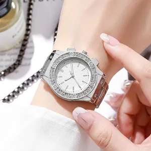 Fashion silver quartz watch with rhinestone bezel and metal link strap on female wrist