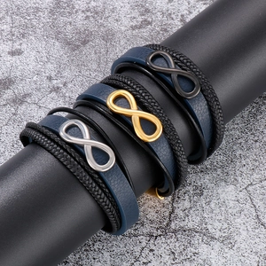 Close-up of multi-layer woven blue leather infinity bracelets with magnetic steel clasps