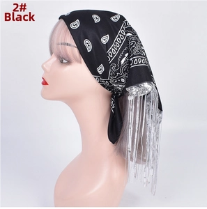 Detail of black paisley bandana with long silver metallic fringe and sequins