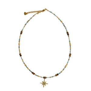 Beaded necklace with Tiger Eye stones and a golden North Star pendant on a white surface