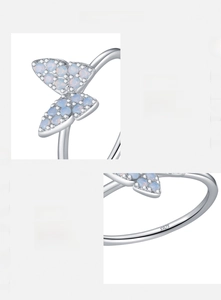 Macro shot of S925 silver ring featuring opal butterfly inlay and hallmark detail
