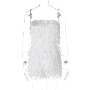 Detailed view of layered white lace ruffles on a strapless summer romper
