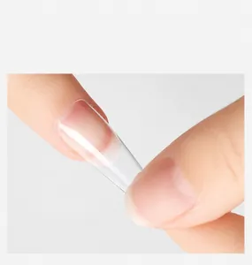 Macro shot of ultra-thin transparent artificial nail tip with high clarity and seamless fit