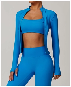 Detail of bright blue yoga jacket sleeve with functional thumbhole and high-stretch fabric
