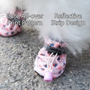 Pink waterproof dog shoes with cartoon print, reflective straps and adjustable drawstrings