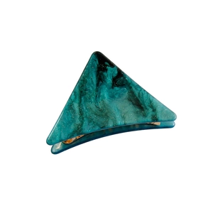 Japanese style green marble triangle hair claw clip with gold accents on white backdrop