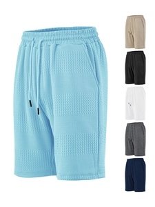Detail of light blue men's horizontal striped jacquard shorts with waffle texture