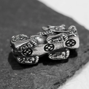 304 stainless steel 18K gold plated PiXiu charm showing engraved characters on dark stone